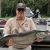 John Galvez holding a clown knifefish