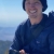 Man holding camera on a mountain