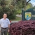 Scott standing next to the office sign.