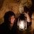 Tina Shaw holds a lantern during a cave tour