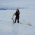 Person holding antler in snow.