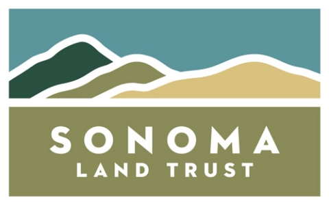 The Sonoma Land Trust logo featuring green and tan hills in the background.