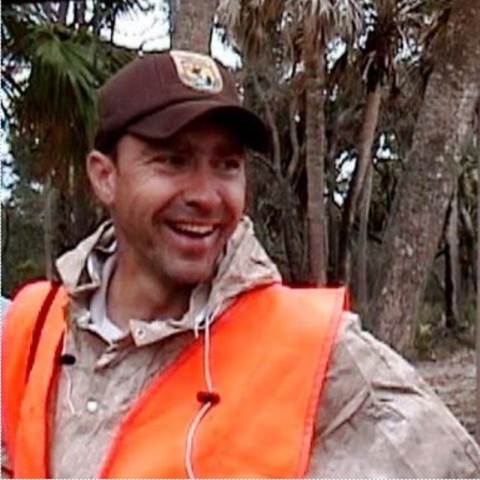 upclose of person smiling wearing FWS hat