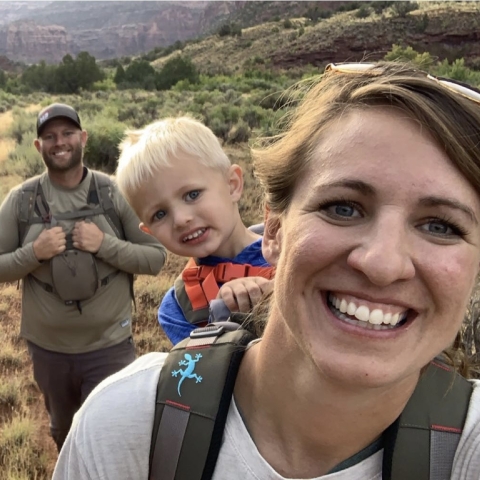 Photo of Mallory and family hiking in Colorado