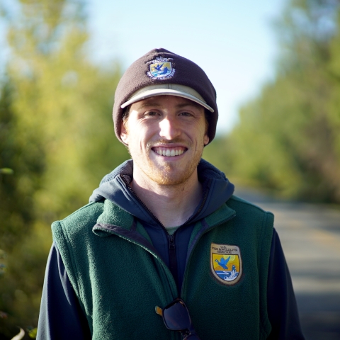 man in hat by a road