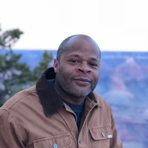 Man in brown jacket