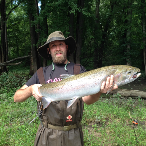 Man in hat holds 2.5 foot fish