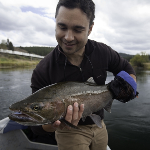 Nathan Dexter holds caught fish