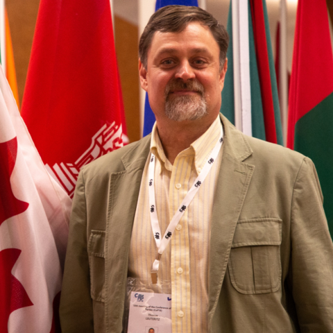 person standing in front of flags