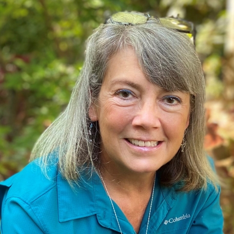 picture of a woman with a green shirt