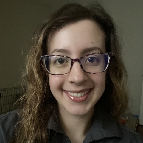 Portrait of Amelia Hunter in a gray USFWS polo shirt and glasses