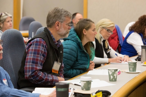 People sitting at table in classroom