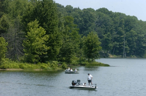 People fishing in two boats on Old Timbers Lake at Big Oaks NWR