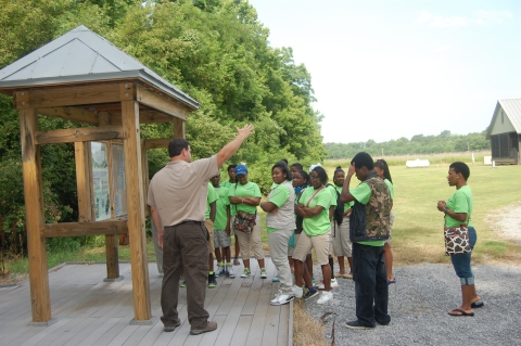 Many kids listening intently to the USFWS speaker