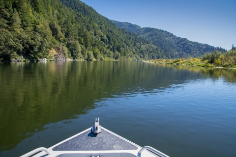 a river with mountains in the background