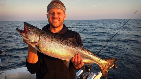 A man holding a large fish