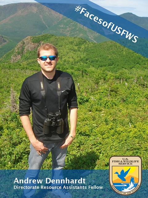 A man wearing sunglasses and holding binoculars