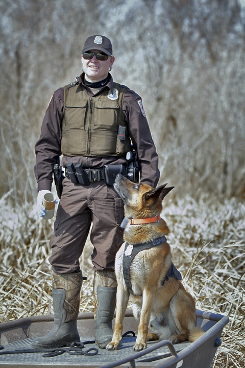 a man and a dog pose for a picture