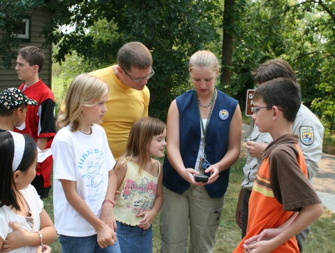 Volunteer conducts a geocaching program