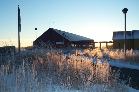 Visitor center building outside on a snowy, sunny early morning