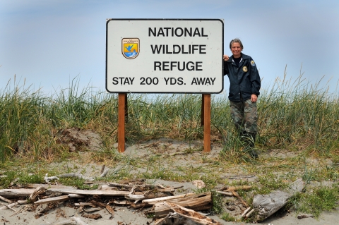 Refuge Volunteer Lori Davis Poses With A Newly Installed Refuge Sign