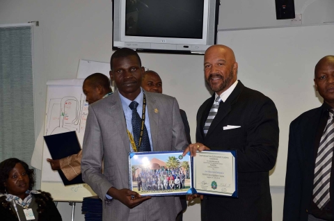 Coordinator Bokandza at his 2014 ILEA Gaborone WTIP graduation with former Director J.O. Smith