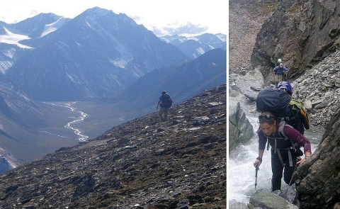 Backpackers hiking on steep, rocky and, in some places, icy trails