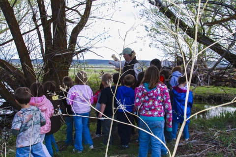 FWS staff leads a group of K-2 students during an afterschool program. 