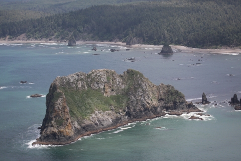 Sharp Crested Jagged Island Looms Offshore 