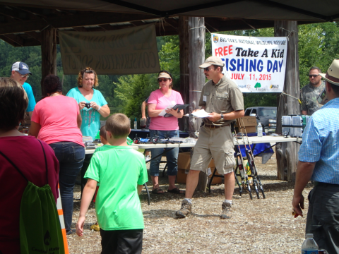 People serving and carrying food at Big Oaks Friends group event