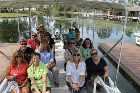 group of people sitting in a boat