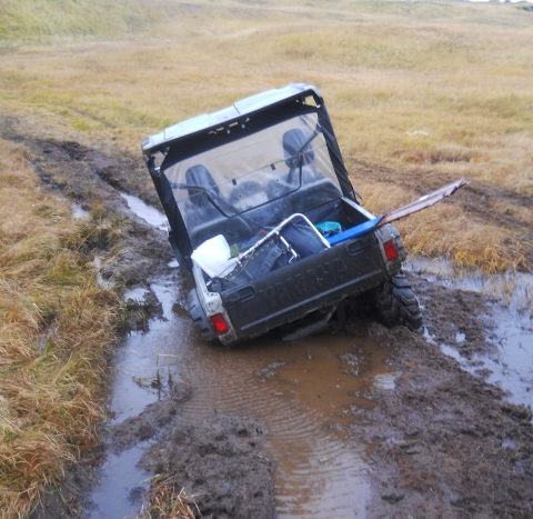 an ATV stuck in the mud