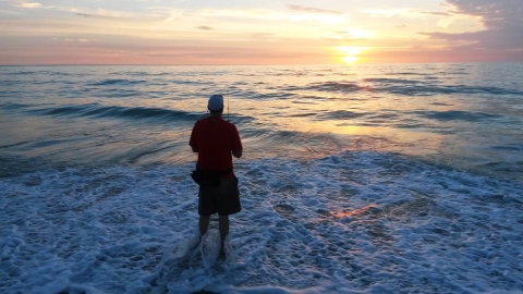 Fisherman fishing on the beach at Archie Carr National Wildlife Refuge