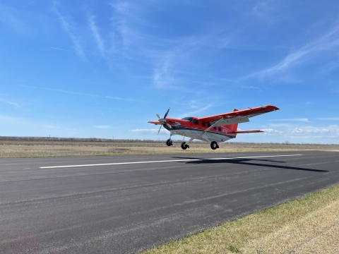 airplane coming in to land on a runway