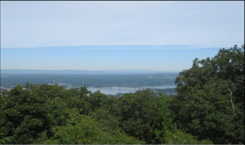 Photograph from a wooded hilltop of the Hudson River 