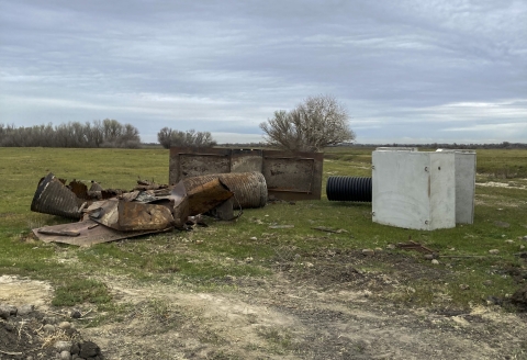 large broken pieces of metal on the ground