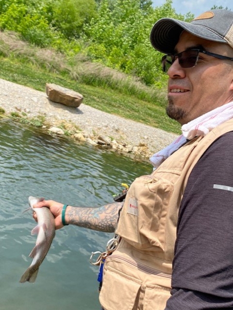 Man holding trout 