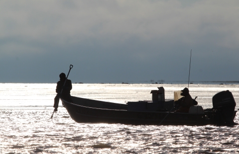 a boat silhouette on the water