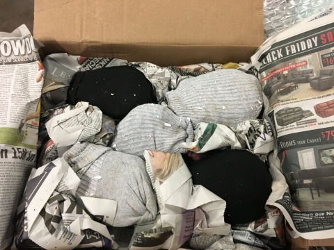 A box full of socks with live turtles stuffed inside