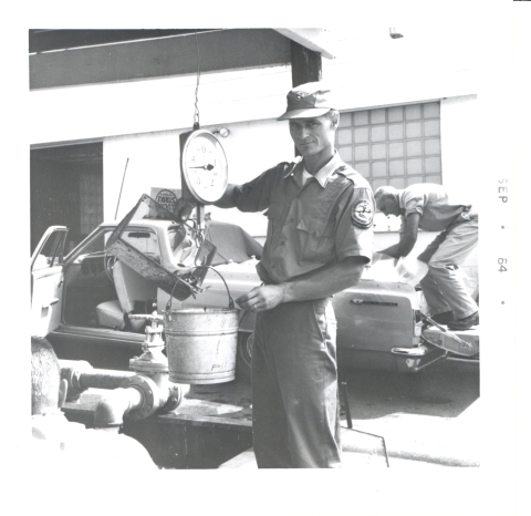 1960's El Camino with truck bed full of bags of live fish to stock