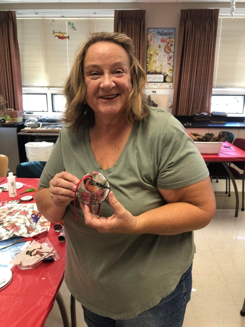 Woman holding Christmas ornament