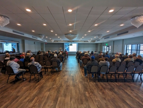 Presentation given to a group of people in a convention center