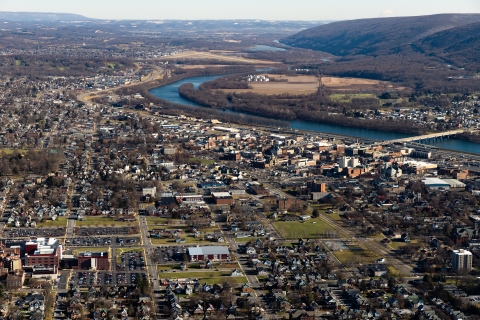 An aerial view of a city alongside a river