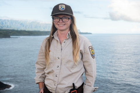 Laurel Smith, smiling in uniform, at Kīlauea Point National Wildlife Refuge in Hawaii. Photo Credit: Angela Iwai-Pineda 