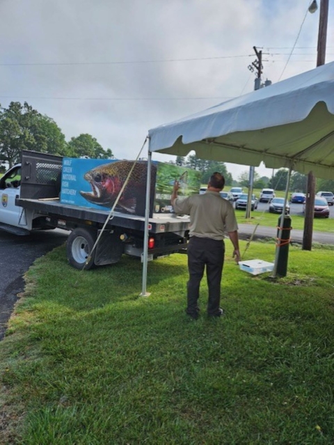 USFWS motions directions for distribution truck backing up 