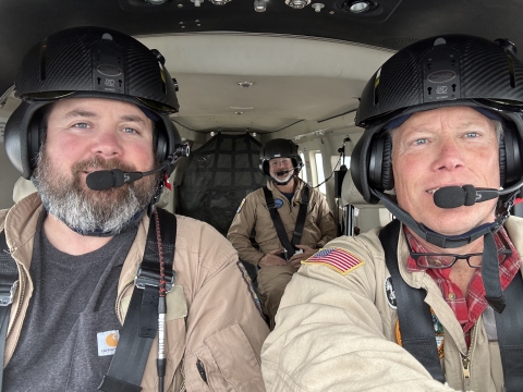 selfie of three people in an airplane