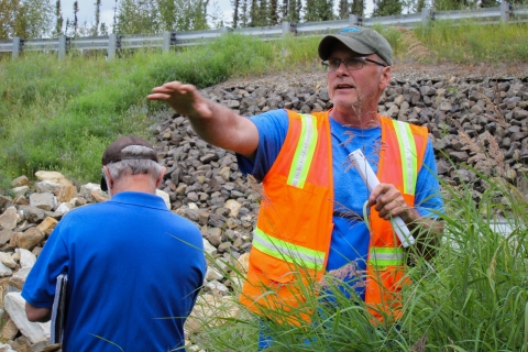 Mitch Osborne leads a group around restored sections of Cripple Creek, July 2023