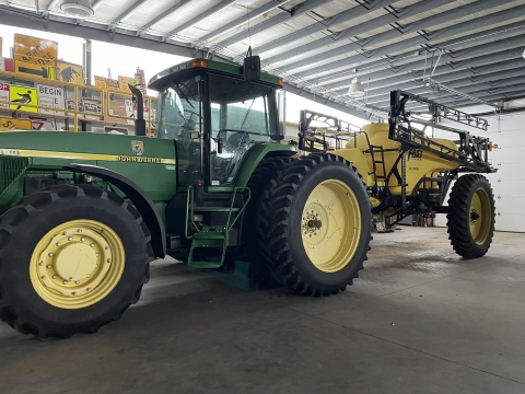 large tractor with an attachment on the back