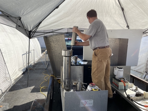 Staff from the NC Wildlife Resources Commission placing trout eggs into a pressurization chamber.