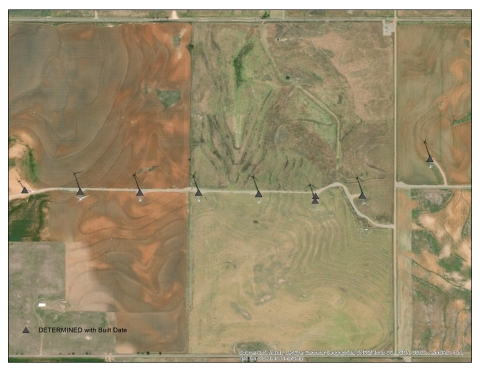 Screenshot of wind turbine location shapefile over aerial imagery background